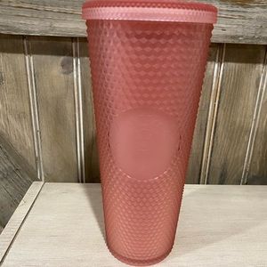 Pink studded Starbucks cup